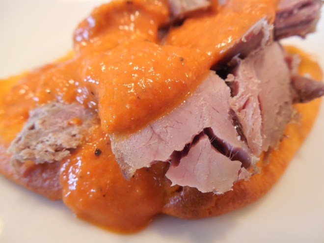 Roasted Red Pepper Sauce Drizzled over Lamb and Scallion Pancake