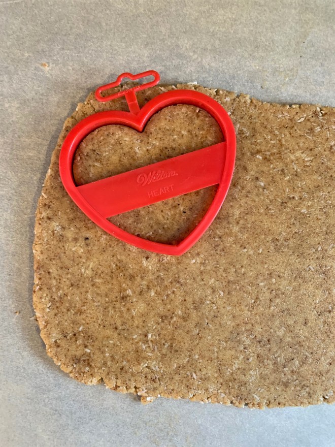 Cutting Out Heart Valentines Day Cookies